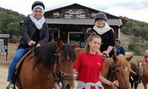 Enjoying the autumn colors from the back of the horses